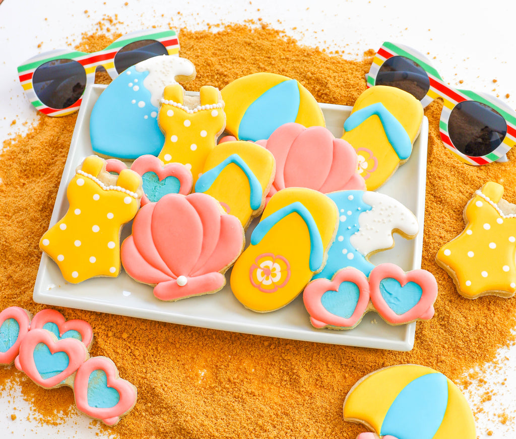 Beach themed gourmet decorated sugar cookie set. Great summer gift idea!  Set comes individually wrapped and in a box with a bow.  Perfect snack for the beach, summer pool party, or to give as a gift!